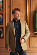Man wearing bespoke tweed jacket in The Cotswolds