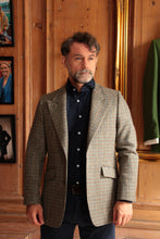 bespoke tweed jacket photographed in tailors showroom in The Cotswolds